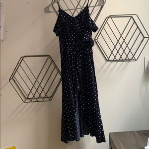 Navy blue and white romper with skirt attachment.